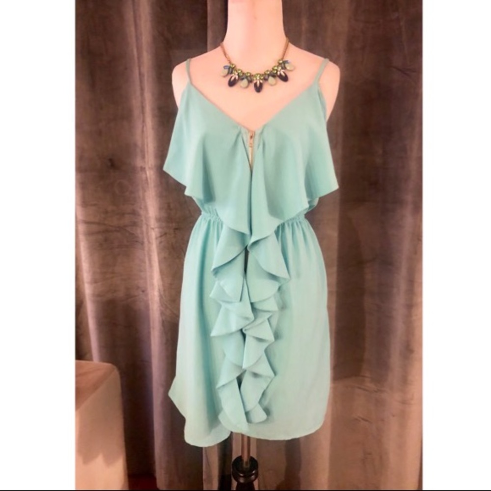 Aqua spaghetti dress with gold zipper front.